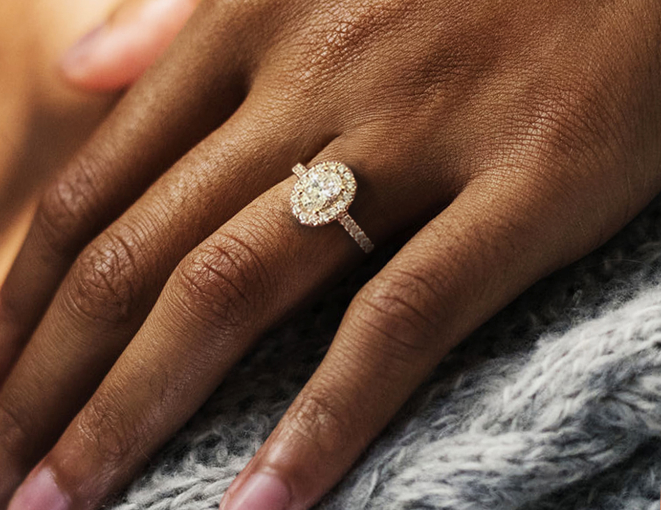 diamond ring on black hand